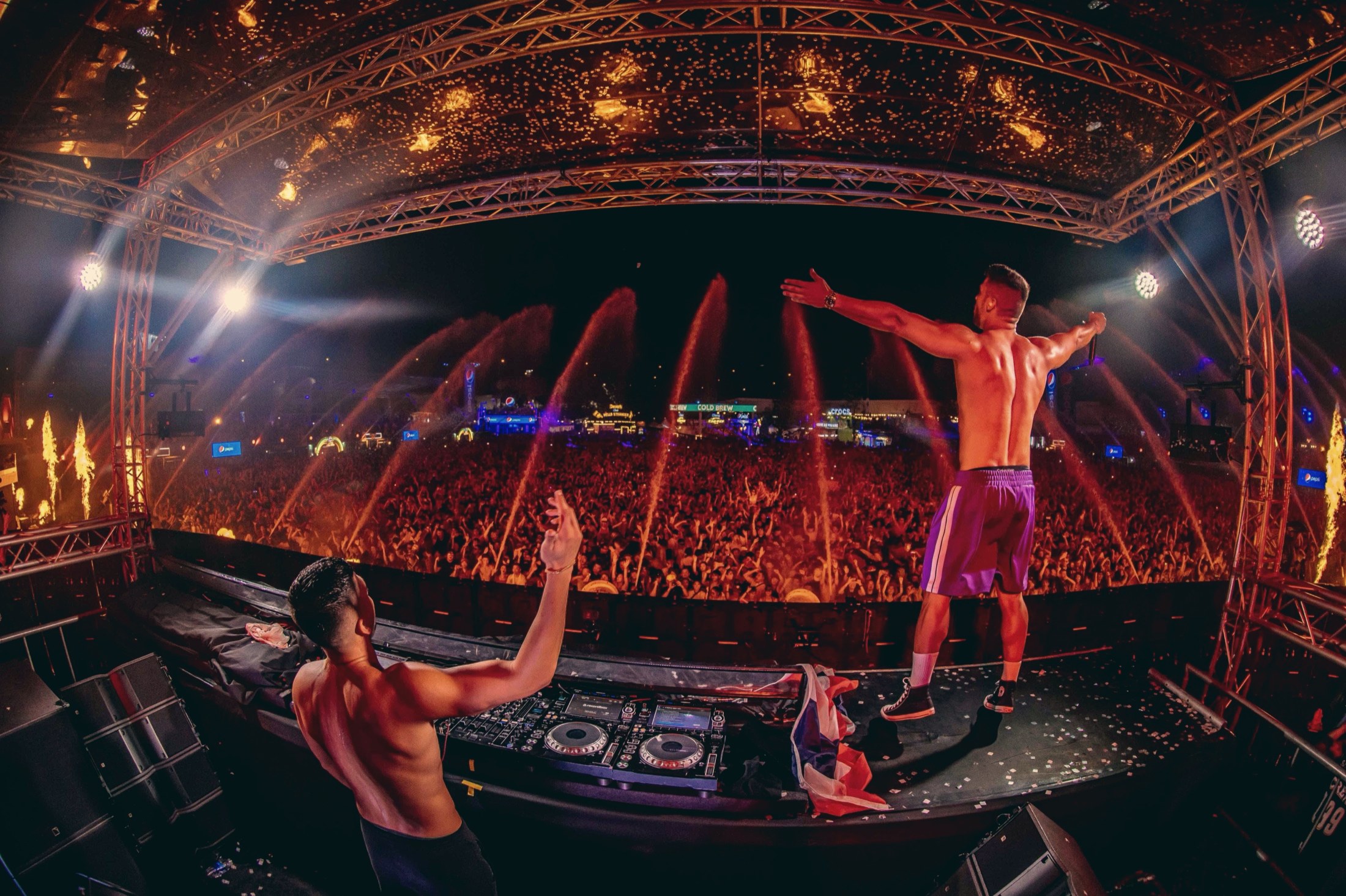 VINAI main-stage festival performance, crowd lit by fire